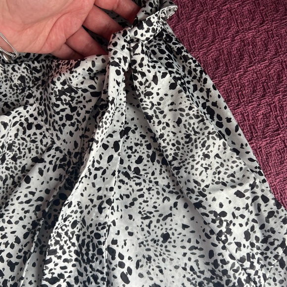 Black and white animal print midi skirt with a satin ish feel to it. - Picture 3 of 5